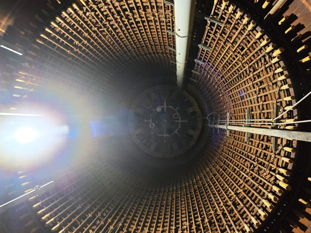 Tunnel shaft beneath the seawater plug, showing the confined environment for lifting operations.