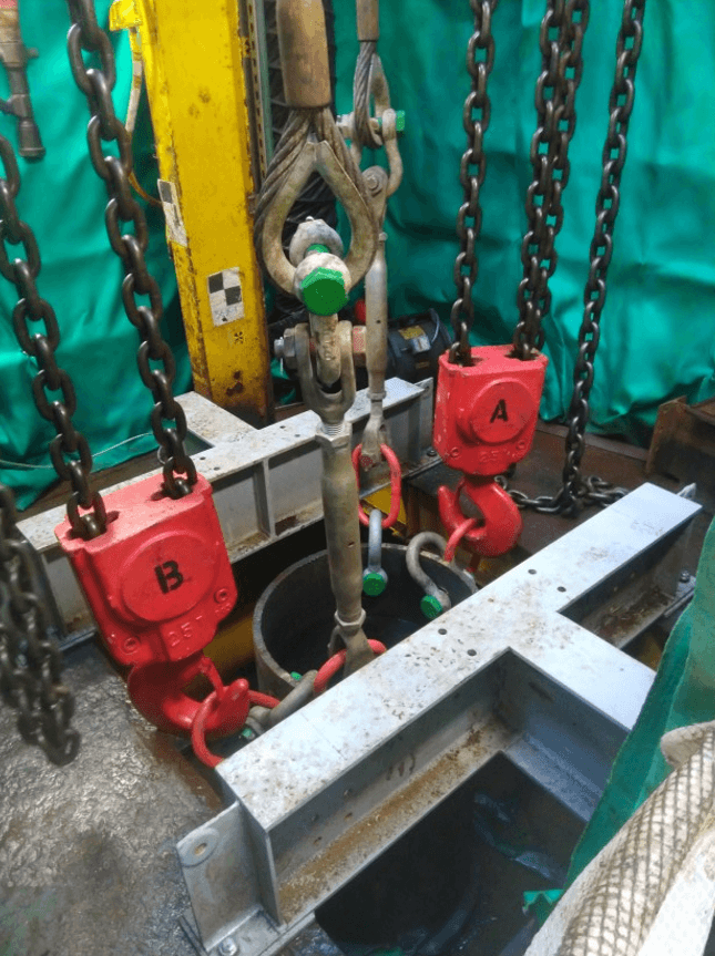 25 tonne air hoist hooks marked A and B for dual control system during offshore conductor removal
